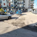 Strada dissestata tra via Barletta e via Papa Giovanni, proteste dei cittadini per buche e avvallamenti